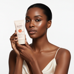 Black woman holding SKINFOOD Tomato Tone Up Sun Cream, inclusive K-beauty skincare — Glow Ritual

