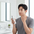 Korean male model applying IOPE Men All Day Perfect Tone Up cream, morning skincare routine, sophisticated and refined appearance
