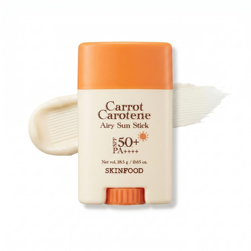 Caucasian woman holding SKINFOOD Carrot Carotene Airy Sun Stick for lightweight SPF sun protection outdoors
