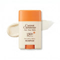 Caucasian woman holding SKINFOOD Carrot Carotene Airy Sun Stick for lightweight SPF sun protection outdoors
