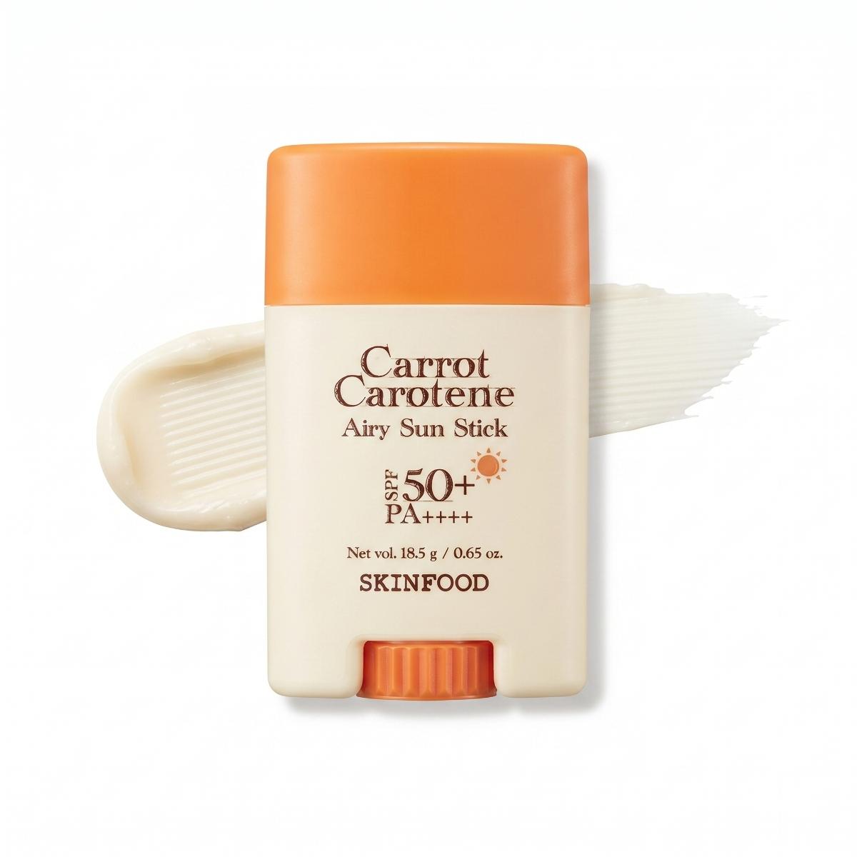 Caucasian woman holding SKINFOOD Carrot Carotene Airy Sun Stick for lightweight SPF sun protection outdoors
