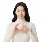 East Asian female model holding SKINFOOD Peach Cotton Zinc PCA Toning Cream round peach-pink sphere jar, white background, sophisticated K-beauty skincare
