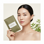 Asian woman holding I'm From Mugwort Sheet Mask packets, K-beauty skincare lifestyle — Glow Ritual
