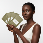 Black woman holding I'm From Mugwort Sheet Mask packets, inclusive K-beauty skincare — Glow Ritual


