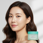 East Asian female model with glowing clear skin, BRINGGREEN Tea Tree Cica Trouble Soothing Toner Pad mint green container beside her, natural light portrait
