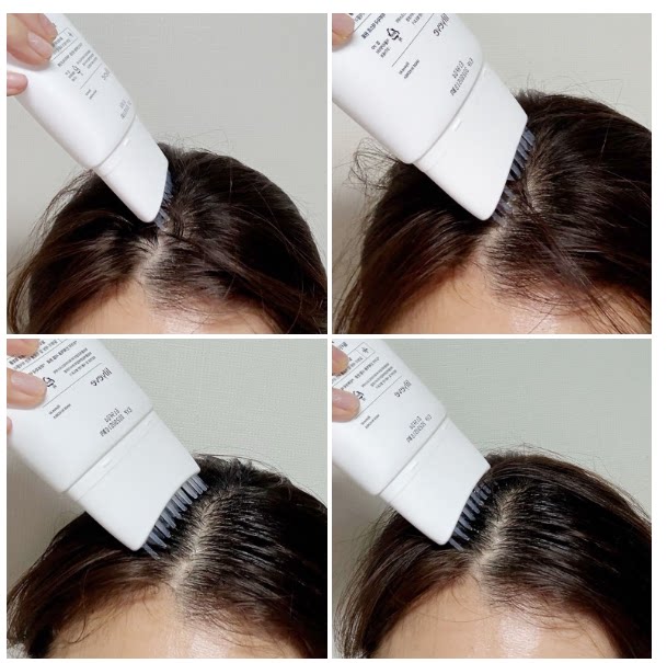 Korean woman applying Lilyeve Scalp Essence Shampoo comb nozzle directly onto scalp parting in bright bathroom

