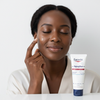 Black woman applying Eucerin Aquaphor Repairing Ointment on face, inclusive dermatological care — Glow Ritual
