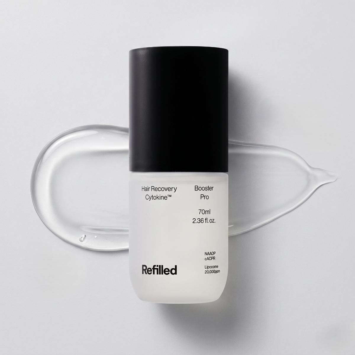 Refilled Hair Recovery Cytokine Booster Pro 70ml — frosted glass bottle with black cap and clear gel texture swatch on light gray background
