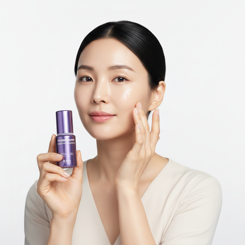 Intelligent Asian woman gently patting BIO HEAL BOH PROBIODERM™ Collagen Remodeling Serum onto cheek – K-beauty firming serum application
