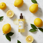 SKINFOOD Yuja C Dark Spot Clear Serum with fresh yuzu fruits flat lay — Korean brightening skincare
