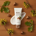 SKINFOOD Acorn Pore Peptide Cream with fresh acorns oak leaves and witch hazel botanical ingredients flat lay
