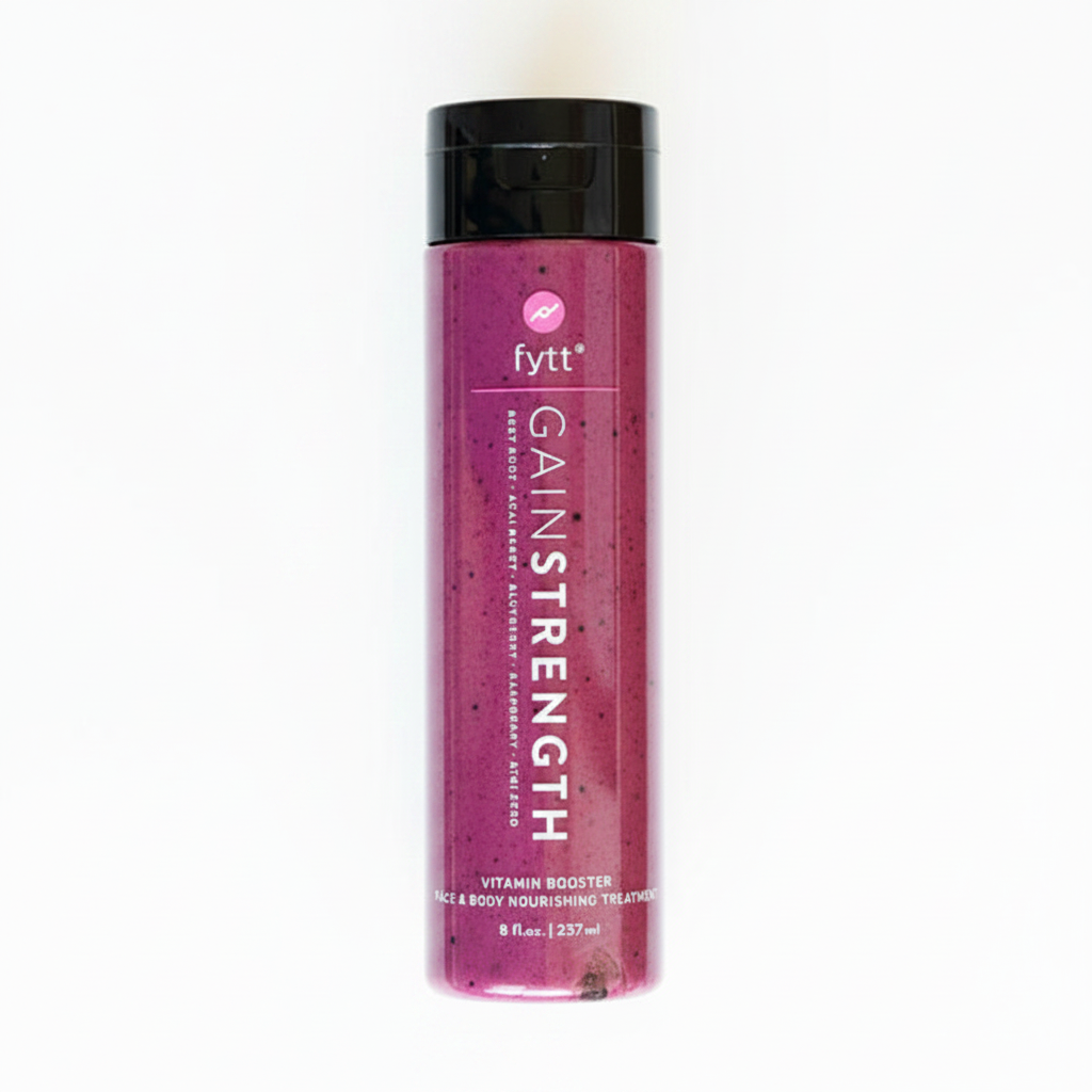 fytt GAIN STRENGTH Ultra-Nourishing Exfoliating Mask 237ml bottle surrounded by fresh berries, beets and blueberries — superfruit face and body treatment
