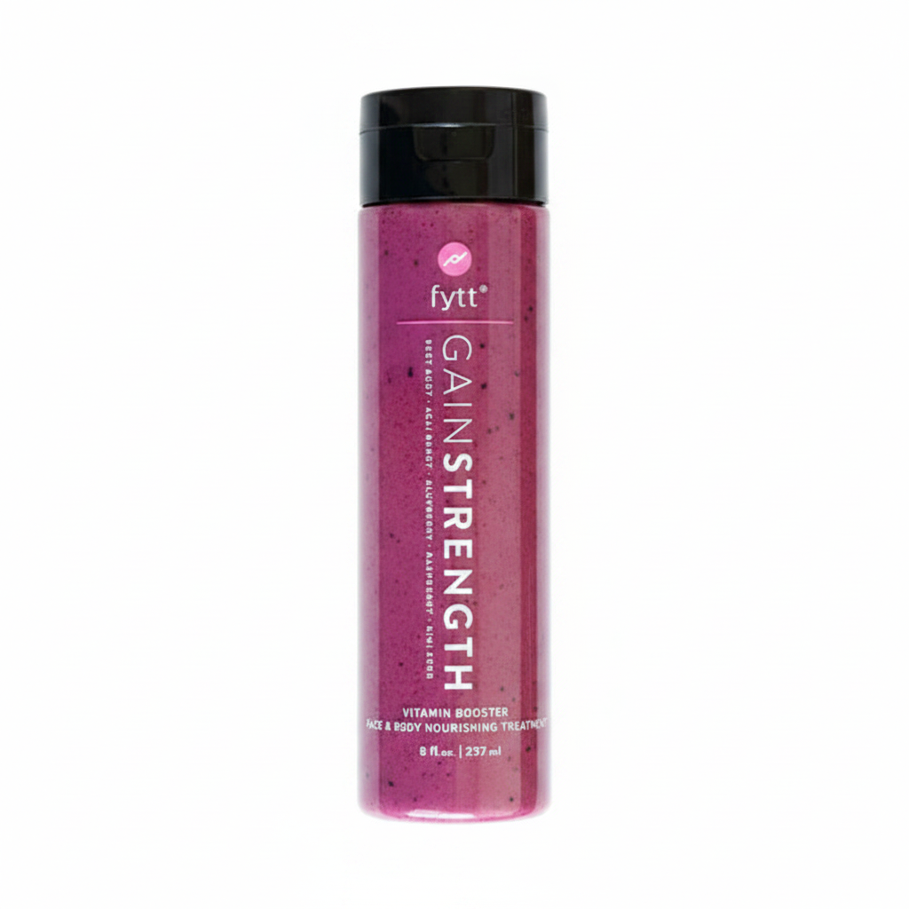After using fytt GAIN STRENGTH Exfoliating Mask — Asian woman with radiant, smooth, glowing skin touching her cheek in bright natural light
 Shot