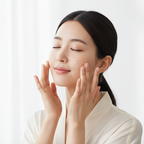 Young Korean woman naturally patting Phyto-5 Peptide Serum onto her face, K-beauty anti-aging skincare routine — Glow Ritual

