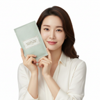 Korean woman holding I'm From Vitamin Tree Sheet Mask sage green pouch close to her face, K-beauty editorial
