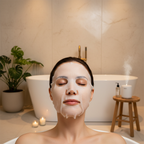 Western woman wearing I'm From Vitamin Tree white sheet mask, spa skincare routine
