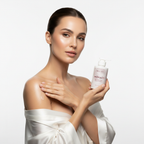Woman applying Monaco Body Glow Serum to skin — aloe vera and sunflower oil body serum routine
